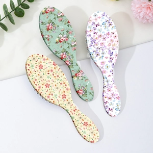 Brosses à cheveux ovales à fleurs avec manches ergonomiques en menthe et ivoire