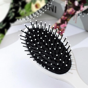 Vintage floral oval cushion hairbrush with white massage beads for scalp care