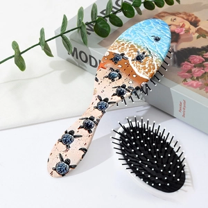 Close-up of hair brushes with sea turtle prints on a stylish lifestyle background