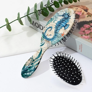Detail showing sea turtle print back and soft air cushion bristles on hairbrush