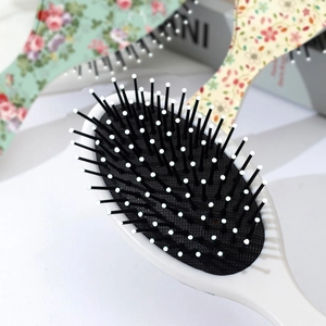 Brosse à cheveux ovale à fleurs avec picots de massage et coussin d'air antistatique