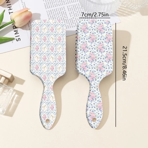 Spazzola per capelli floreale con trama a griglia blu e fiori rosa per massaggio