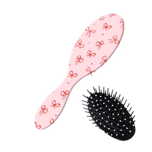Spazzola per capelli rosa con fiocchi rossi e cuscino d'aria per massaggio
