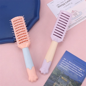 Detail of pink and purple vented hair brushes with cute 3D cat paw handles on the base