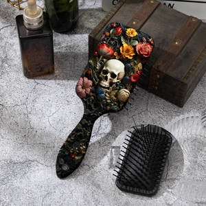 Detail of gothic skeleton and floral relief on a professional scalp massage air cushion brush