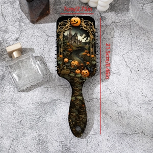 Halloween pumpkin print paddle hairbrush with castle motifs and 21.5cm size details
