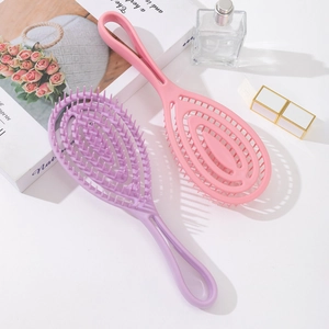 Pink and purple hollow vent hairbrushes for scalp massage and volumizing hair styling