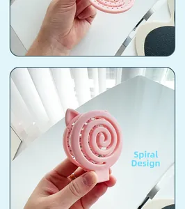 Pink cat-ear spiral hairbrush in a compact folded design for easy travel portability