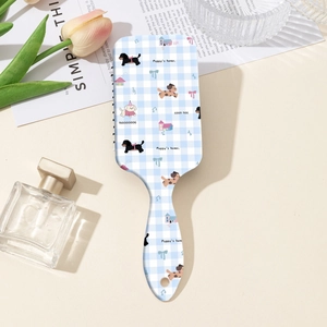 Detail of dachshund print hairbrush with air cushion on a checkered blue background