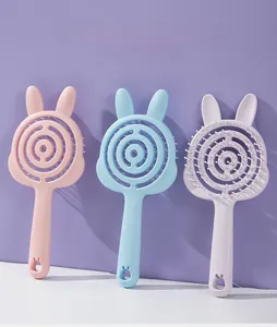 Three rabbit-shaped hollow hair combs in pink blue and purple colors shown from the front