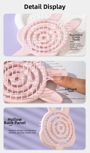 Pink rabbit-shaped hollow hairbrush with flexible bristles and round massage tips
