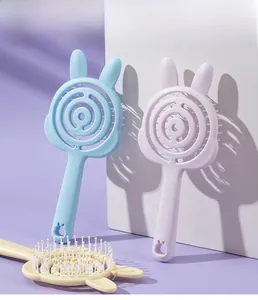 Macro detail of cute bunny-shaped hollow hair combs in pastel blue, purple and beige colors