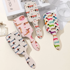 Lot de quatre brosses à cheveux massantes à coussin d'air avec motifs de teckel colorés