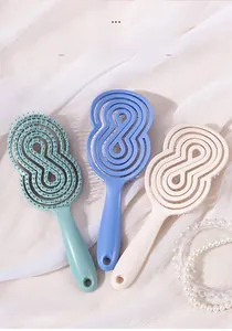 Trois brosses à cheveux ajourées en vert Morandi, bleu et blanc ivoire pour démêlage