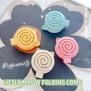Set of four pastel foldable cat-ear hair combs in blue, yellow, pink and white