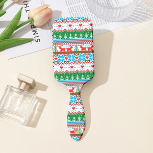 Détail de brosse à cheveux de Noël avec motifs de renne et de flocons de neige