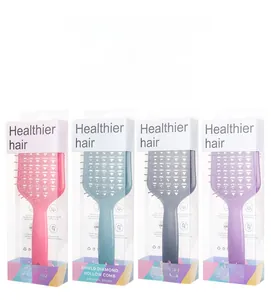 Detail of shield diamond hollow hairbrush set in pink, blue, grey and purple packaging