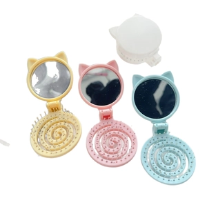 Portable folding cat-ear hair brush with mirror in four pastel gradient colors