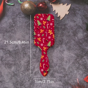 Detailed view showing dimensions of a red Christmas themed hairbrush with gingerbread man