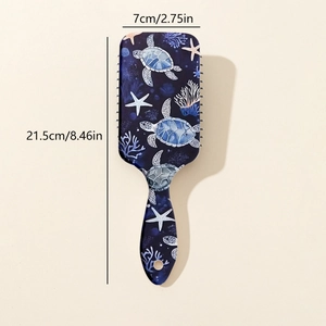 Detail view of printed paddle hairbrush with ocean sea turtle design and 21.5cm length