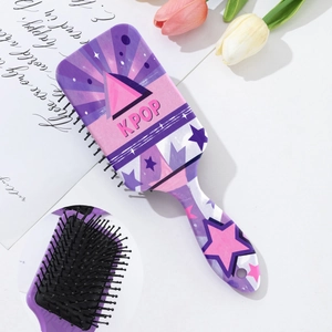 Detail of kpop printed air cushion hairbrush with anti-static black bristles and star pattern