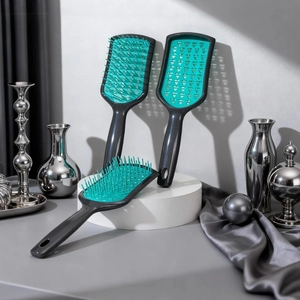 Three-piece vented hair brush set with ergonomic grey handles and teal bristles for styling