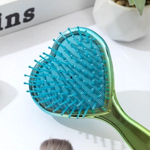 Blue-green heart shaped hair brush with air cushion massager and anti-static bristles