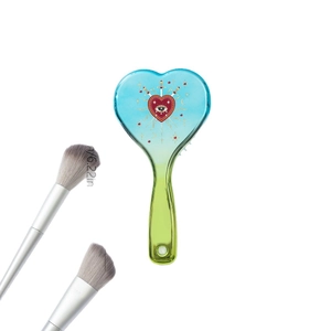 Blue gradient heart-shaped paddle brush with mystical eye pattern and soft massage bristles