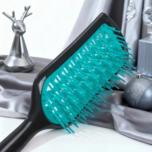 Vented paddle hair brush with teal bristles and black geometric hollow frame design