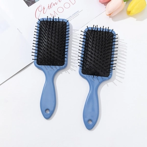 Light blue square cushion hairbrush set with scalp massage bristles on white background