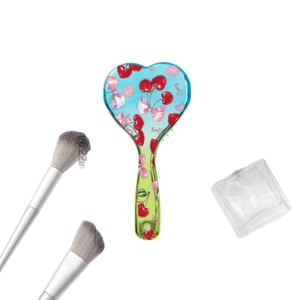 Heart-shaped cherry bow hairbrush with blue gradient and 6.22-inch length measurement