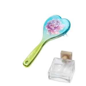 Heart-shaped air cushion hairbrush featuring colorful floral print and blue yellow gradient