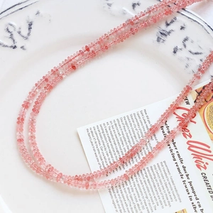 Detailed shot of pink translucent flat round natural stone beads for DIY jewelry making
