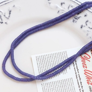 Macro shot of lilac purple agate beads for DIY jewelry and phone charms in soft light