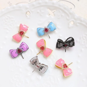 Handmade gold-plated bow hairpins with heart crystals in seven assorted vibrant colors