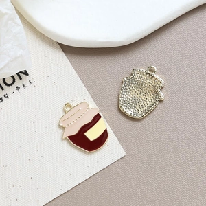 Macro detail of enamel jam jar pendant with honeycomb texture metal back for DIY jewelry