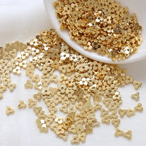 Bulk gold clover spacer beads with polished finish for DIY jewelry making and beadwork