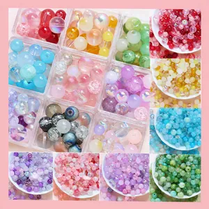 Assorted DIY mixed acrylic beads with bubble and frosted textures in a storage box