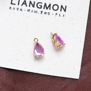 Close-up of pink pear-shaped cubic zirconia pendant in a gold-plated claw setting