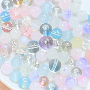 Detailed macro view of assorted macaron glass beads with cat paw shape for DIY jewelry