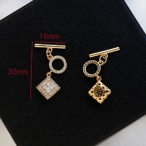Detailed view of 18k gold plated OT toggle clasp with cubic zirconia pave and mesh texture