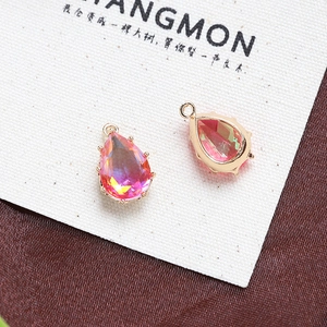 Detail of pear-shaped lavender crystal pendants with gold claw setting for DIY jewelry making