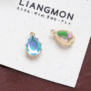 Detailed view of aurora crystal pear pendant with gold prong setting for DIY jewelry