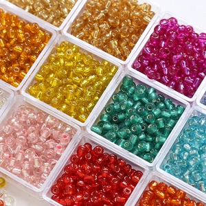 Colorful 4mm glass gold foil seed beads in transparent containers for DIY jewelry making