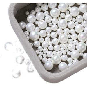 Lustrous white high-gloss pearl beads for DIY jewelry making displayed on a jewelry tray