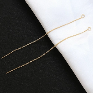 Close-up of S925 sterling silver gold-plated long ear threads with cross chain detail