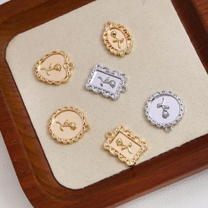Macro detail of retro rose embossed pendants in gold and silver for DIY jewelry making