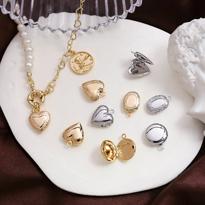 Detailed view of vintage gold and silver locket pendants with pearl coin necklace