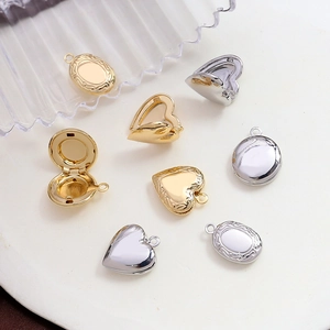 Vintage gold and silver plated locket pendants with embossed patterns in various shapes
