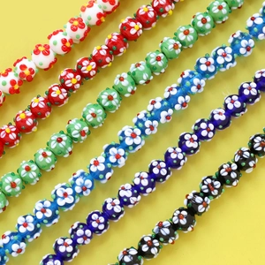Macro view of colorful millefiori glass flower beads for DIY jewelry making and crafts